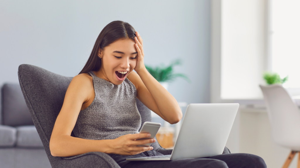 A person sitting in a chair with a laptop