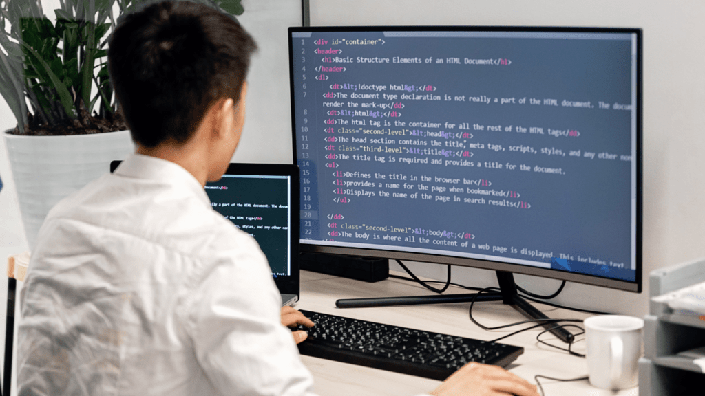 a person writing a code in a computer