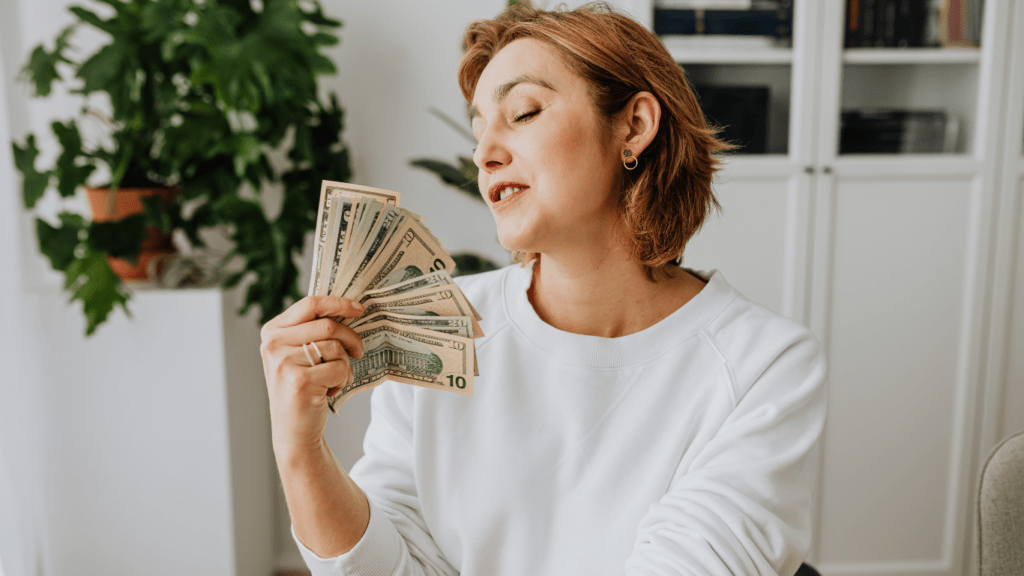 a person holding a us dollar