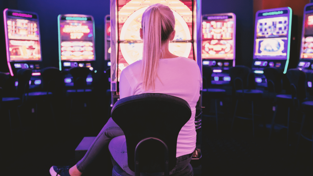 a person in front of slot machine