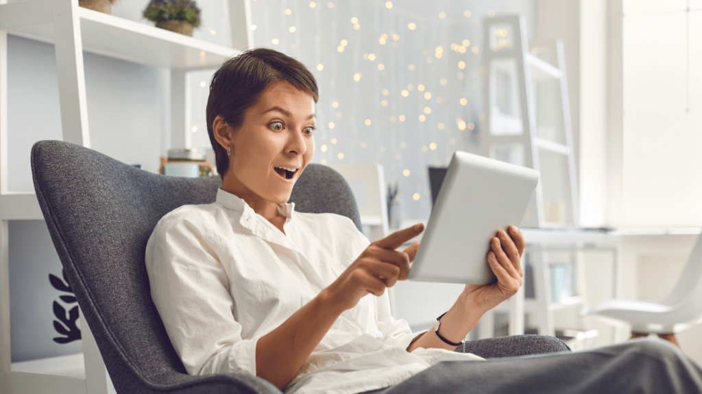 A person sitting in a chair with a laptop