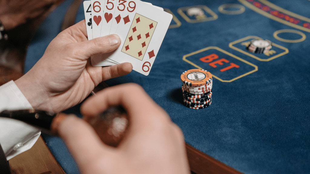 a person holding a blackjack cards