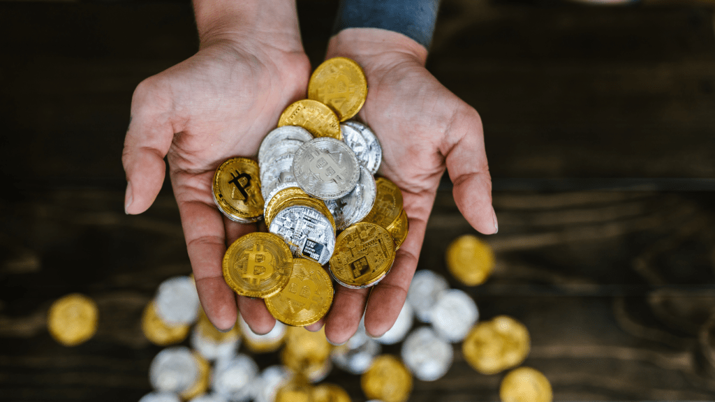 a person holding a crypto coins