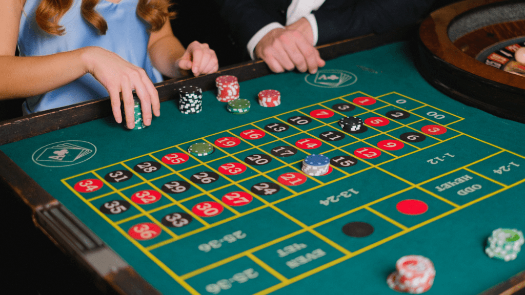 a person holding a casino chips