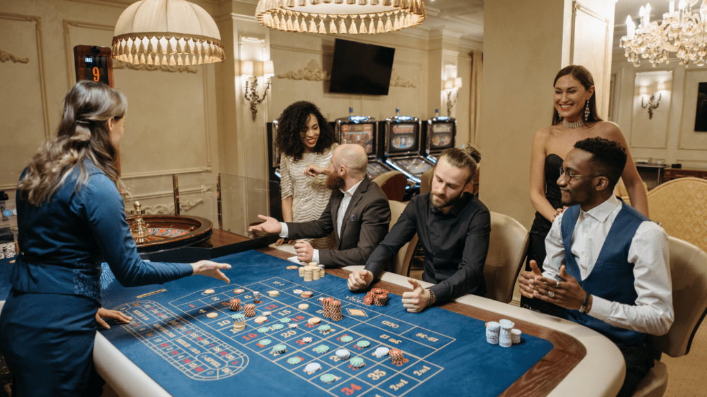 a group of people playing roulette at a casino table