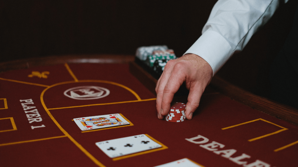 a person hand with casino chips