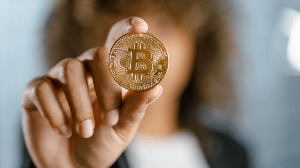 a person holding a bitcoin