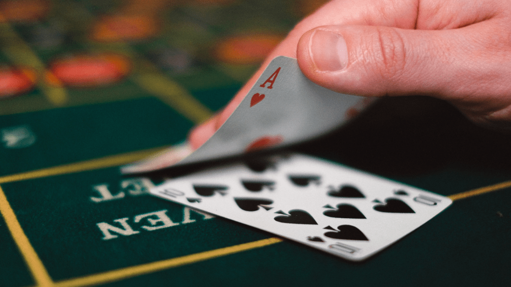 a person holding a blackjack cards