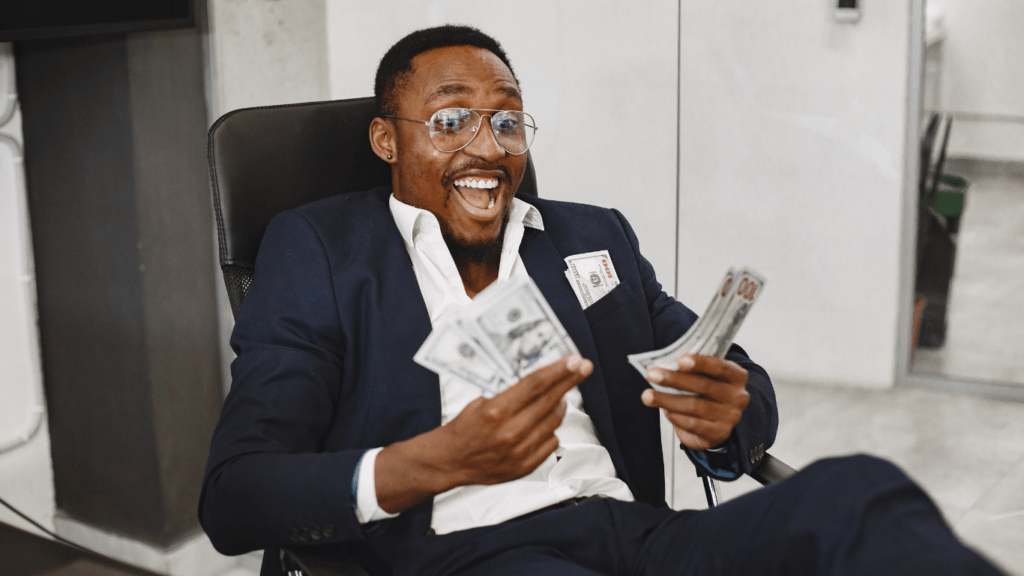 a person holding a us dollar