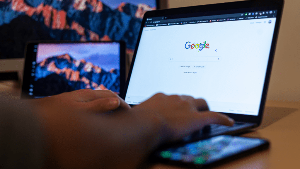 a person typing in the laptop