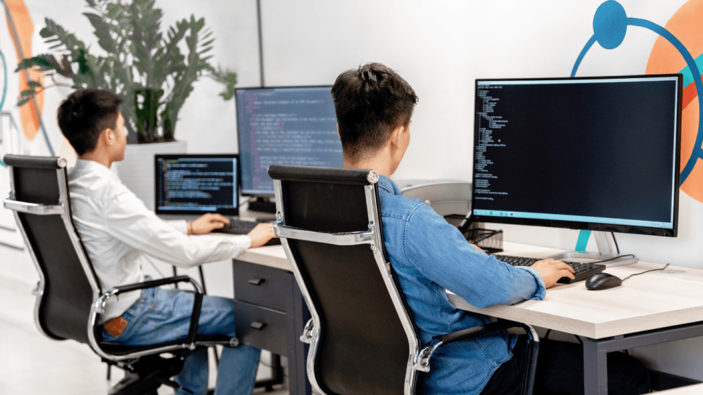 a person writing a code in a computer